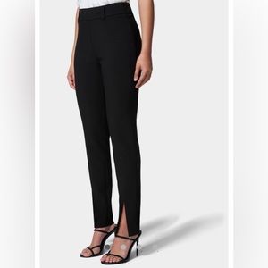 Size 2 black front slit slim leg slacks size 2. Never been worn.